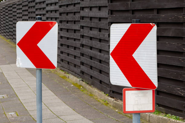 two warning signs before a bend in the road