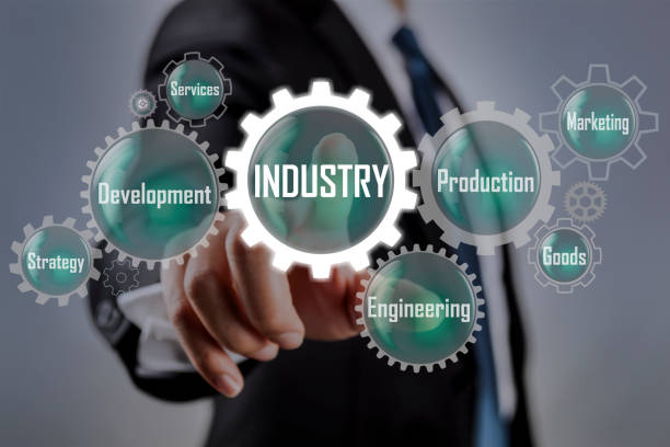 Production of goods and services with businessman in background.