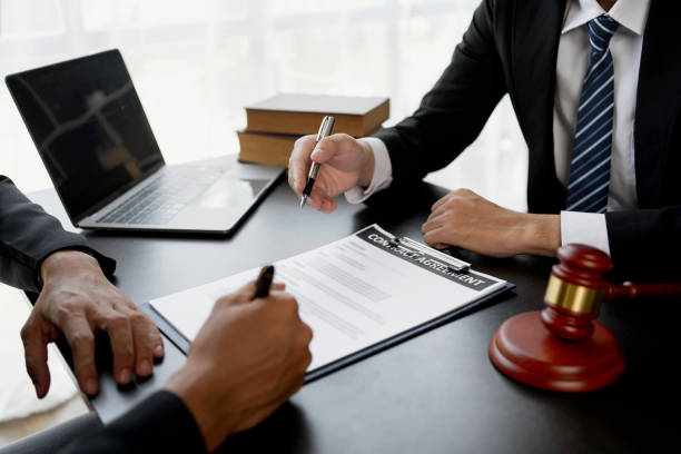 Businessman and lawyer discuss the contract document. Treaty of the law. Sign a contract business.