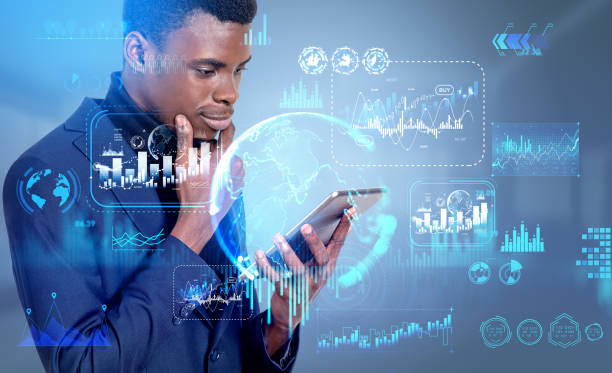 Black businessman with pensive look, working with tablet. Financial chart hologram and stock market graphs, digital business diagrams. Concept of forex