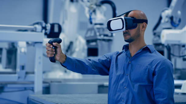 Virtual reality, robotics and innovation with an engineer man using technology to access the metaverse in a factory. Automation, industry 4.0 and vr goggles with a male warehouse employee in a plant