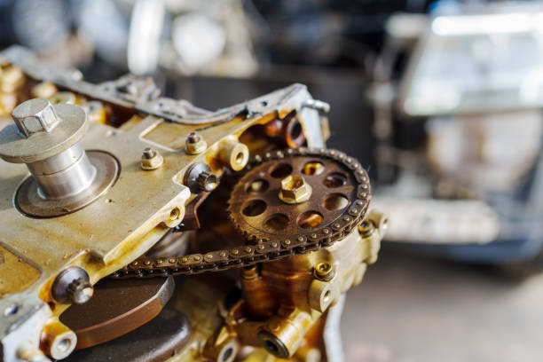 Auto mechanic repair engine in a car repair shop and Checking a car engine for repair at car garage.Car engine repair. Car service