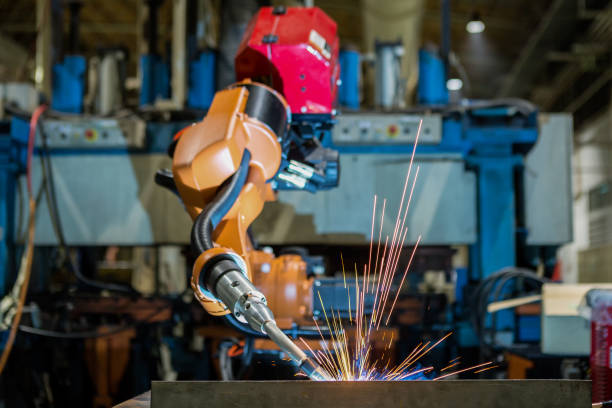 Robot welding is welding metal part in factory