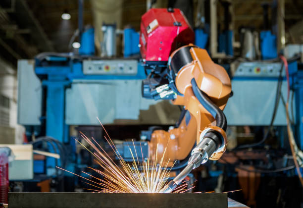 Robot welding assembly car part in factory
