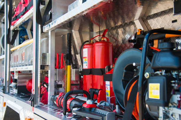 Compartment of rolled up fire hoses on a fire engine. Rescue fire truck equipment